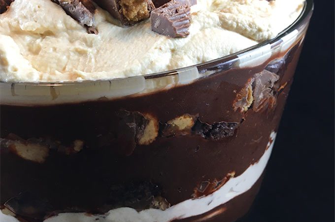 Chocolate Peanut Butter Trifle with Peanut Butter Whipped Cream only looks hard to make! Brownie crumbles, homemade peanut butter whipped cream and creamy chocolate pudding layer with chopped peanut butter cups.