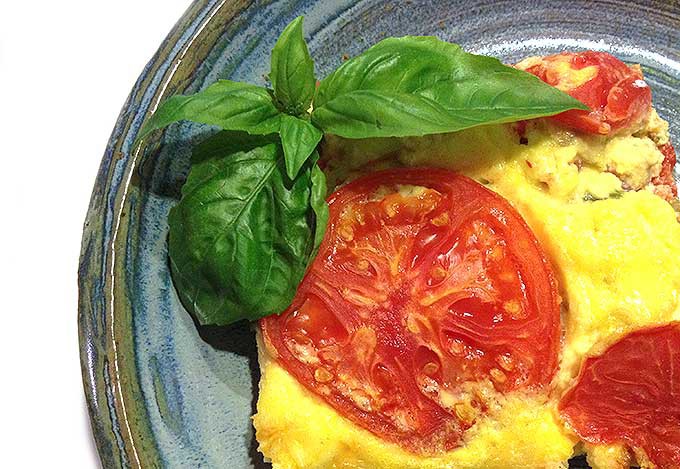 Cheesy Artichoke Oven Omelet: salsa, artichokes, cheese and eggs. Top with tomato rounds for a festive main dish brunch.