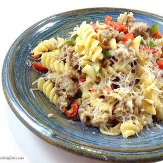 Sausage Pepper Pasta Toss. Easy and satisfying. Flavorful winter main dish with just five ingredients. Parmesan and cream combine to make cheese sauce. Yum!