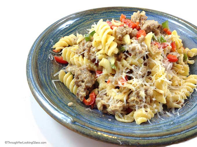 Sausage Pepper Pasta Toss. Easy and satisfying. Flavorful winter main dish with just five ingredients. Parmesan and cream combine to make cheese sauce. Yum!