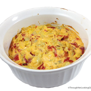 Baked Cheesy Artichoke Dip. Mmmmm. Creamy, melty parmesan, garlic, artichokes and sweet roasted red peppers. Serve with veggies, pita chips, blue corn chips