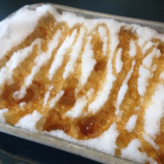 Delicious Maple Taffy on Snow. An old-fashioned French tradition. Boil the syrup, sugar, butter and vanilla. The taffy caramelizes and hardens on the snow.