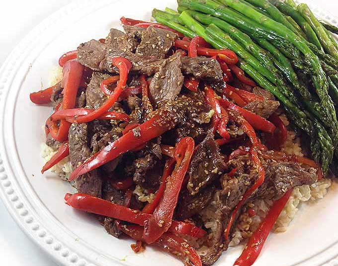 Sesame Beef & Red Peppers w/Roasted Asparagus. Try a relaxed night in, great food and great company. Sesame Beef, Roasted Asparagus and stunning Chocolate Raspberry Tart.