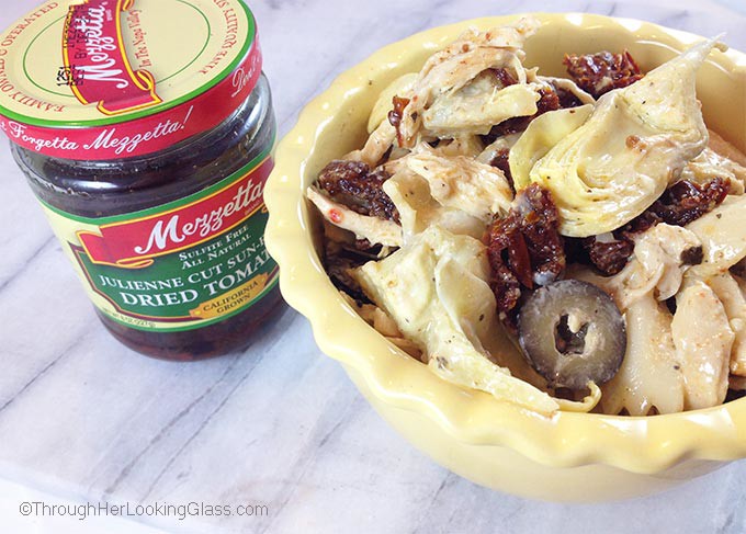 Chicken Artichoke Pasta Salad with Sun Dried Tomatoes: a bold tasting main dish pasta salad. Perfect for spring and summer, picnics and outdoor concerts.