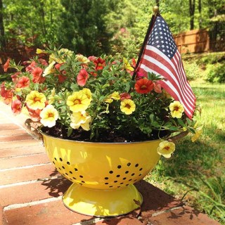 This DIY Colander Planter is so easy to make & adds a touch of whimsy to your porch or patio. This pretty planter is like a breath of fresh air.