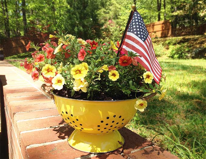 This DIY Colander Planter is so easy to make & adds a touch of whimsy to your porch or patio. This pretty planter is like a breath of fresh air.