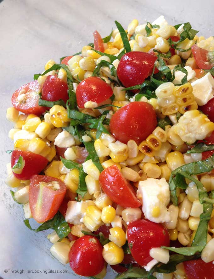 This Grilled Corn Basil and Tomato Salad brings fresh and summer straight to your next picnic, barbecue or luncheon.