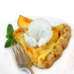 Peach custard pie with vanilla ice cream on top