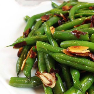 Brown Butter Toasted Almond Green Beans. Steamed green beans with a little snap, drenched in brown butter, toasted almonds. Sprinkled with sea salt.