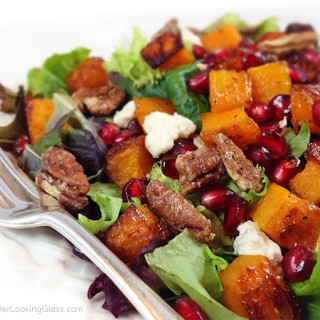 Maple Roasted Butternut Squash & Pomegranate Harvest Salad. The butternut squash is golden and caramelized. Zippy homemade pomegranate blender dressing.