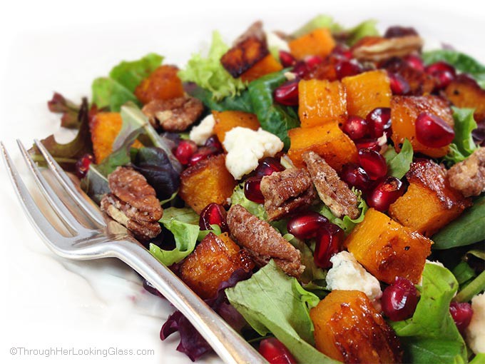 Maple Roasted Butternut Squash & Pomegranate Harvest Salad. The butternut squash is golden and caramelized. Zippy homemade pomegranate blender dressing.