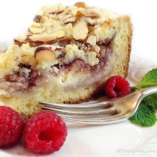 Raspberry Cream Cheese Coffee Cake: Almond cake, cream cheese filling, raspberry preserves and toasted almond crumb topping. Heaven!