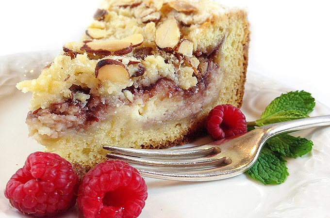 Raspberry Cream Cheese Coffee Cake: Almond cake, cream cheese filling, raspberry preserves and toasted almond crumb topping. Heaven!