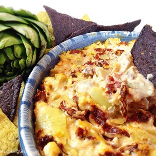 Hot Feta Artichoke & Sun-Dried Tomato Dip. Goes fast! Sun-dried tomatoes, artichokes, feta and garlic combine for a creamy and addictive appetizer dip. Serve hot with bagel chips, tortilla chips or plain crackers.