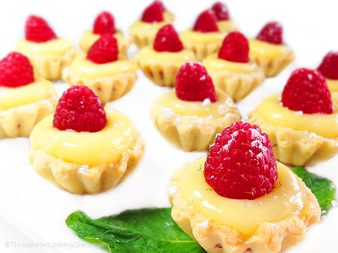 Irresistible Raspberry Lemon Tartlets. Crunchy, light tart shells layered with seedless raspberry jam, lemon curd and fresh raspberries. Need I say more?