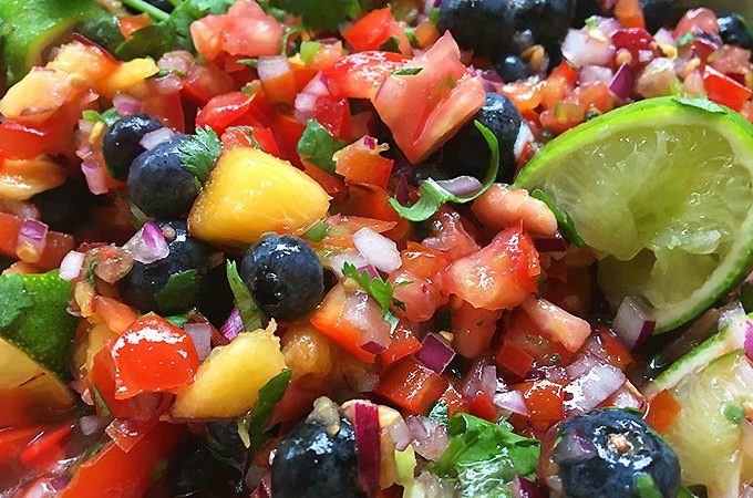 Fresh Peach Blueberry Salsa: fruity salsa with a delicious bite! This fresh salsa is so addictive. The peaches and blueberries are a sweet surprise!