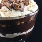 Chocolate Peanut Butter Trifle with Peanut Butter Whipped Cream only looks hard to make! Brownie crumbles, homemade peanut butter whipped cream and creamy chocolate pudding layer with chopped peanut butter cups.