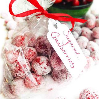 Festive Sugared Cranberries. Bursting w/flavor that pops in your mouth. Sweet & tart. Tangy & addictive. Perfect cheesecake garnish, snack, stocking stuffer or gift. Pretty and delicious on the cheese tray.