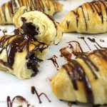 Pain Au Chocolat (Chocolate Croissant Recipe): Light, flaky, chocolate-filled buttery croissants with chocolate drizzle. Impressive bakery-style pastries.