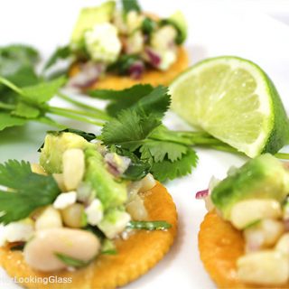Easy Spring Appetizers w/Fresh Herbs! Herbs mingle w/veggies, cheese and fresh ingredients to create flavorful, scrumptious toppings for Ritz Crackers!