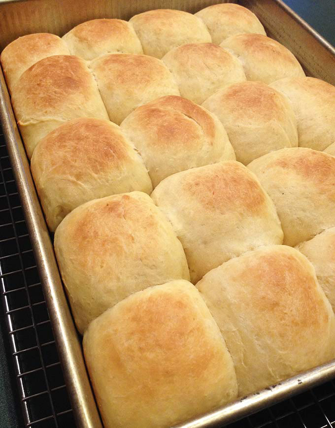 Love these pillowy homemade Yeast Rolls, hot and fresh from the oven. Split 'em in half, melt a pat of butter in between. These yeast Rolls are divine.