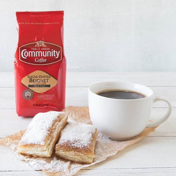 A mug of Sugar Dusted Beignet Coffee by Community Coffee