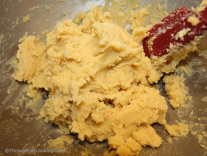 Here's a buttery shortbread Lemon Curd Easy Thumbprint Cookie Recipe for cheerful springtime baking! Buttery shortbread cookies nest dollops of yummy sweet & sour lemon curd. If you love lemon curd like I do, this is the easy cookie for you!