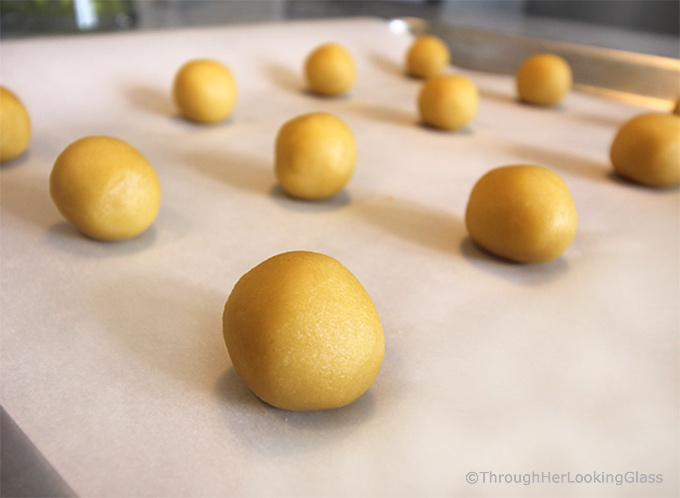 Here's a buttery shortbread Lemon Curd Easy Thumbprint Cookie Recipe for cheerful springtime baking! Buttery shortbread cookies nest dollops of yummy sweet & sour lemon curd. If you love lemon curd like I do, this is the easy cookie for you!