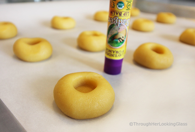 Here's a buttery shortbread Lemon Curd Easy Thumbprint Cookie Recipe for cheerful springtime baking! Buttery shortbread cookies nest dollops of yummy sweet & sour lemon curd. If you love lemon curd like I do, this is the easy cookie for you!