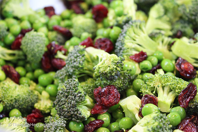 Crunchy Broccoli Salad with Bacon is the perfect side dish for all your picnics and barbecues this summer! It combines surprising ingredients - salty and sweet - making for a yummy new salad that won't wilt!