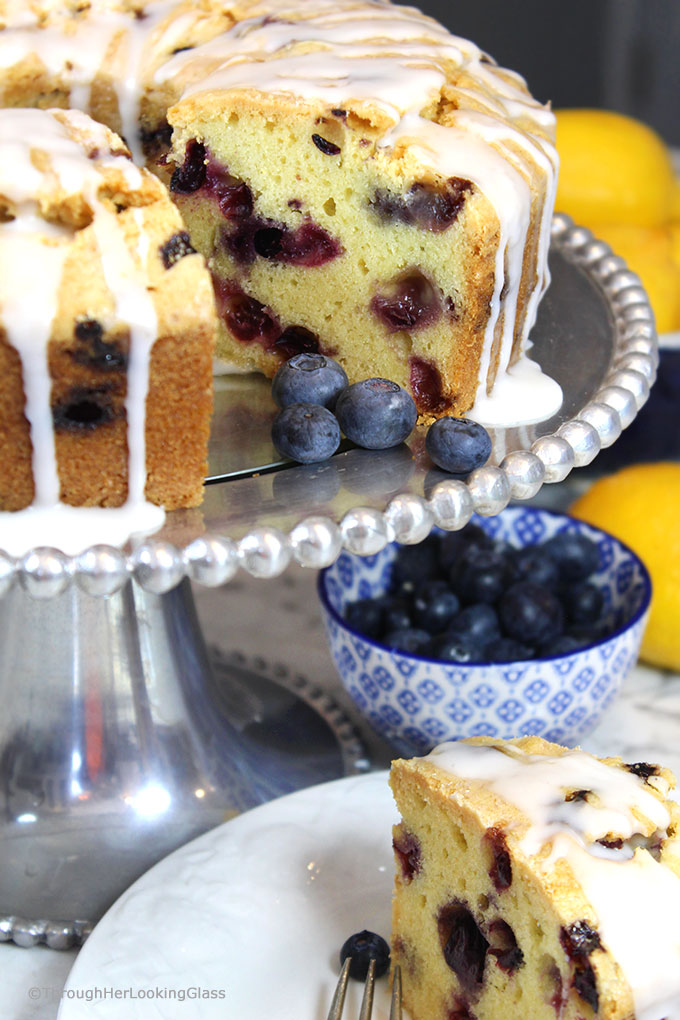 A generous slice of this Glazed Lemon Blueberry Pound Cake is especially scrumptious on the sun porch accompanied by a tall glass of fresh squeezed lemonade. And a sprig of mint. Tender, buttery lemon pound cake is studded with fresh, juicy blueberries for the perfect summer combo.