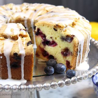 A generous slice of this Glazed Lemon Blueberry Pound Cake is especially scrumptious on the sun porch accompanied by a tall glass of fresh squeezed lemonade. And a sprig of mint. Tender, buttery lemon pound cake is studded with fresh, juicy blueberries for the perfect summer combo.