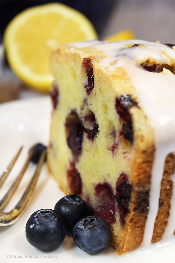 A generous slice of this Glazed Lemon Blueberry Pound Cake is especially scrumptious on the sun porch accompanied by a tall glass of fresh squeezed lemonade. And a sprig of mint. Tender, buttery lemon pound cake is studded with fresh, juicy blueberries for the perfect summer combo.