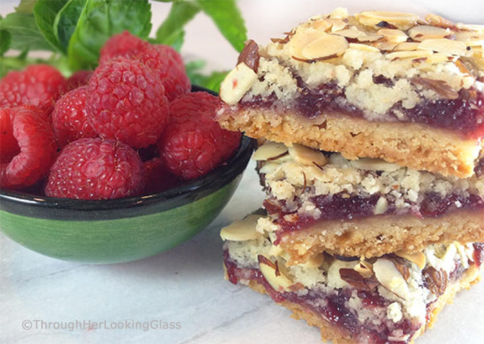 These old-fashioned Peach & Raspberry Shortbread Squares (w/Almonds) are perfect for picnics and lunch boxes this summer. Crunchy and sweet, buttery and packed with peach, almond & raspberry flavor.