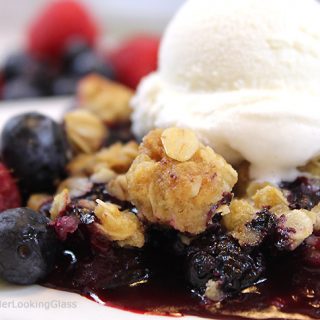 This Summer Triple Berry Crumble Recipe has all the berry-licious fresh summer flavors you crave: blueberries, blackberries and raspberries. All topped with a sweet and crunchy oatmeal crumble.
