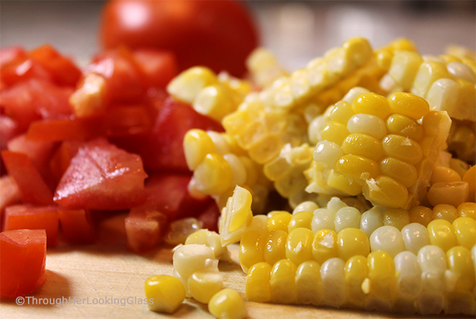 This Summer Corn Basil Tomato & Feta Easy Omelette Recipe is sure to please your friends and family for breakfast, lunch or dinner. Summer corn and juicy, ripe tomatoes combine with fresh garden basil and salty feta for a flavor-full omelette.