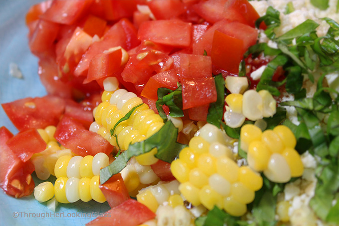 This Summer Corn Basil Tomato & Feta Easy Omelette Recipe is sure to please your friends and family for breakfast, lunch or dinner. Summer corn and juicy, ripe tomatoes combine with fresh garden basil and salty feta for a flavor-full omelette.