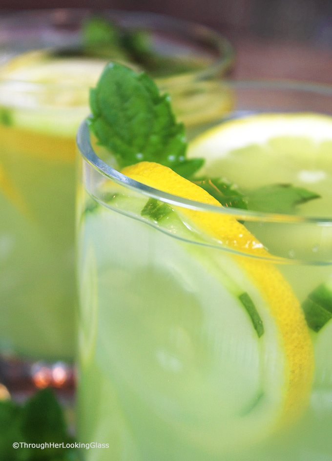 Mint Infused Cucumber Lemonade is a refreshing cold, all natural drink on a hot day. Sweet lemonade combines with fresh cucumber juice and muddled mint and is delicious iced! Refreshing cold sip for a hot summer's day.