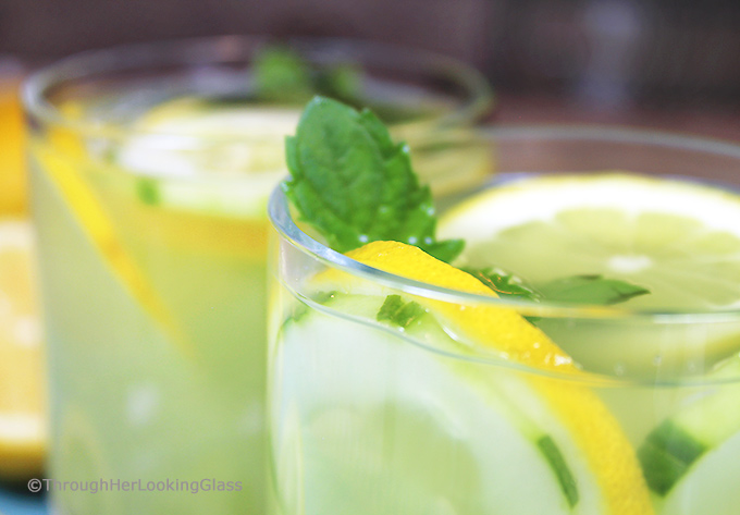 Mint Infused Cucumber Lemonade is a refreshing cold, all natural drink on a hot day. Sweet lemonade combines with fresh cucumber juice and muddled mint and is delicious iced! Refreshing cold sip for a hot summer's day.