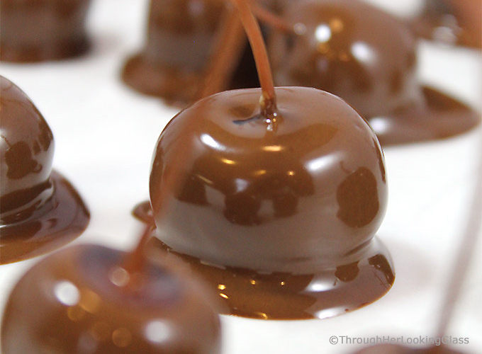 Homemade Chocolate Covered Cherries are a pop of delicious flavors in your mouth! Dunk dye-free, preservative free maraschino cherries in chocolate for an extra special treat at the holidays. Soak cherries in rum, brandy or alcohol first for extra flavor pop!