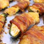 Crispy, cheesy and oh so addictive! Bacon Wrapped Stuffed Jalapeños are the most coveted game day appetizer on the planet. Fresh jalapeños are stuffed with a cream cheese cheddar mixture, then wrapped with bacon.