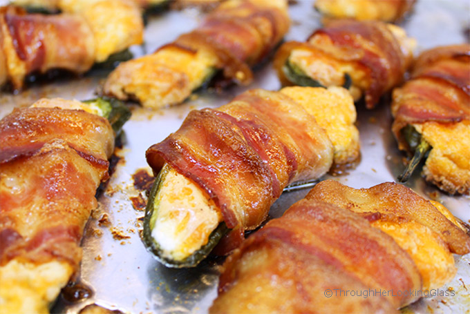 Crispy, cheesy and oh so addictive! Bacon Wrapped Stuffed Jalapeños are the most coveted game day appetizer on the planet. Fresh jalapeños are stuffed with a cream cheese cheddar mixture, then wrapped with bacon.